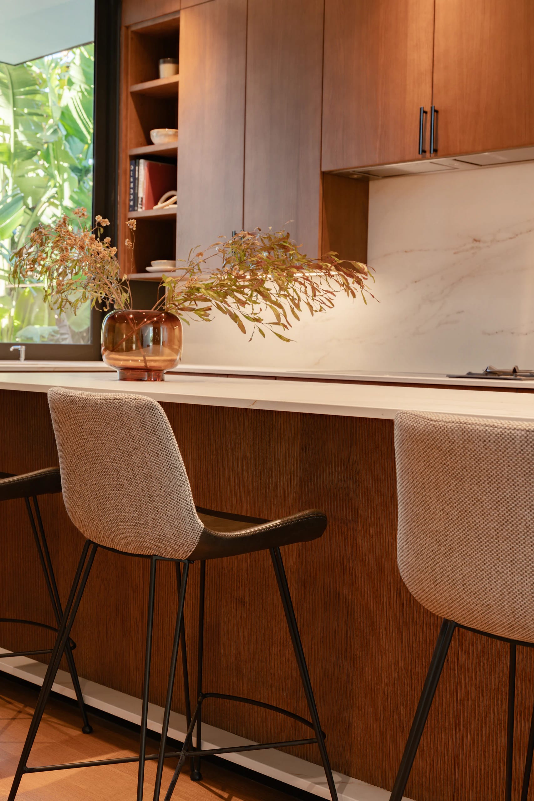Minimalist kitchen with natural wood cabinetry and clean lines