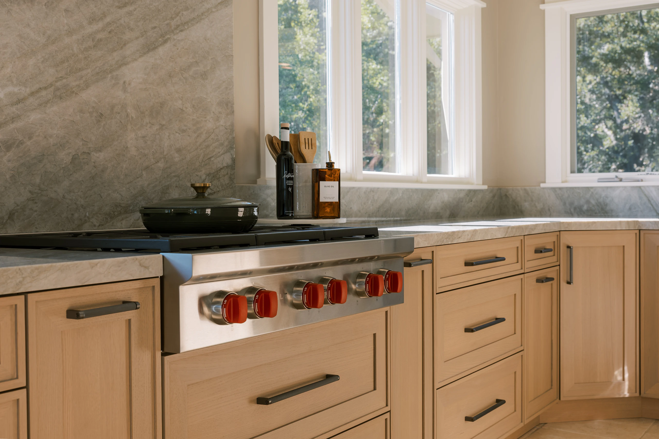 Wood-Mode custom kitchen with cabinetry surrounding a marble range
